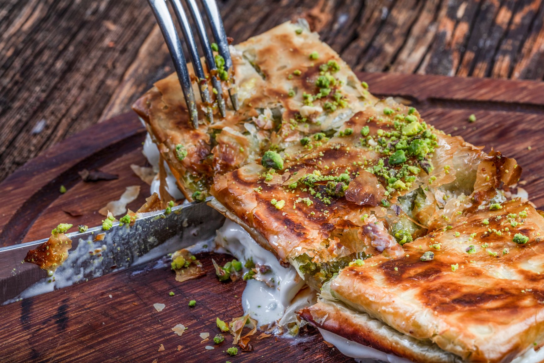 Turkish Dessert Katmer with Pistachio Powder served with ice cream.